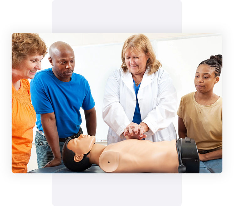 A group of people standing around an instructor.