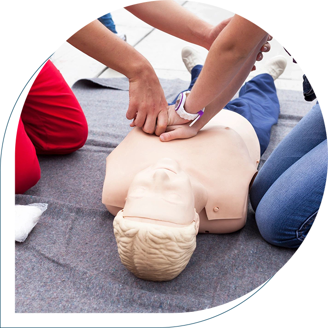 A person is performing cpr on an infant dummy.