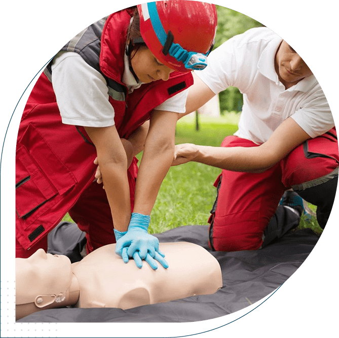 A group of people practicing cpr on an infant dummy.