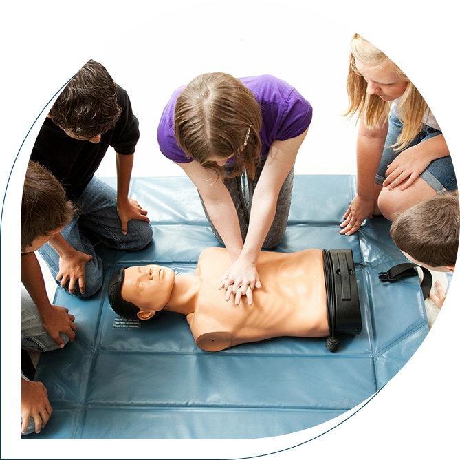 A group of people standing around an instructor.