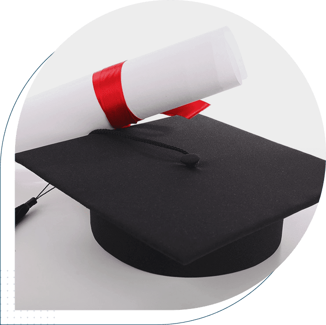 A graduation cap and diploma on top of a table.